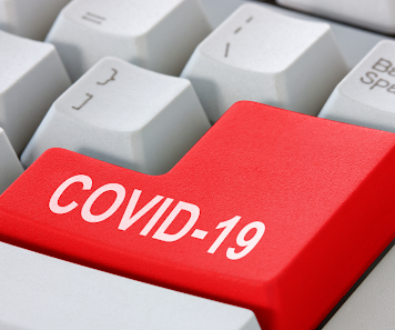 Πλήκτρο πληκτρολογίου που αναφερει τη λέξη covid 19